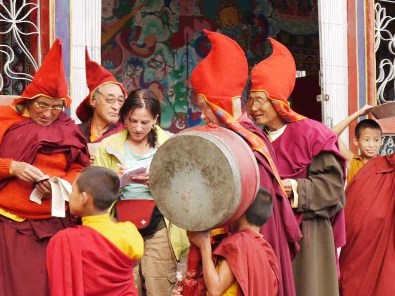 Helen exchanges contacts with locals in a monastery in North-Sikkim. (2000) Image